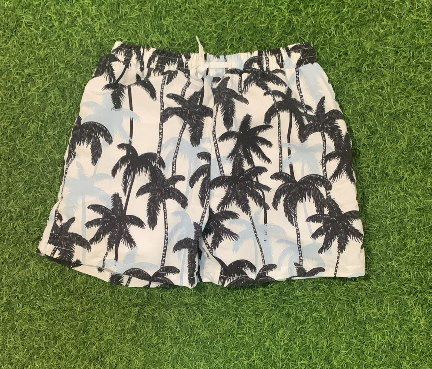 White with black palm tree swim shorts